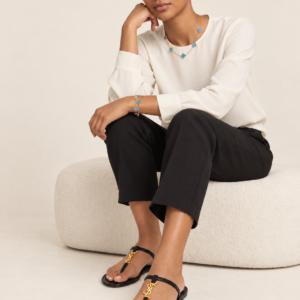Model wearing black t strap sandals