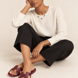 Model wearing burgundy cutout slides