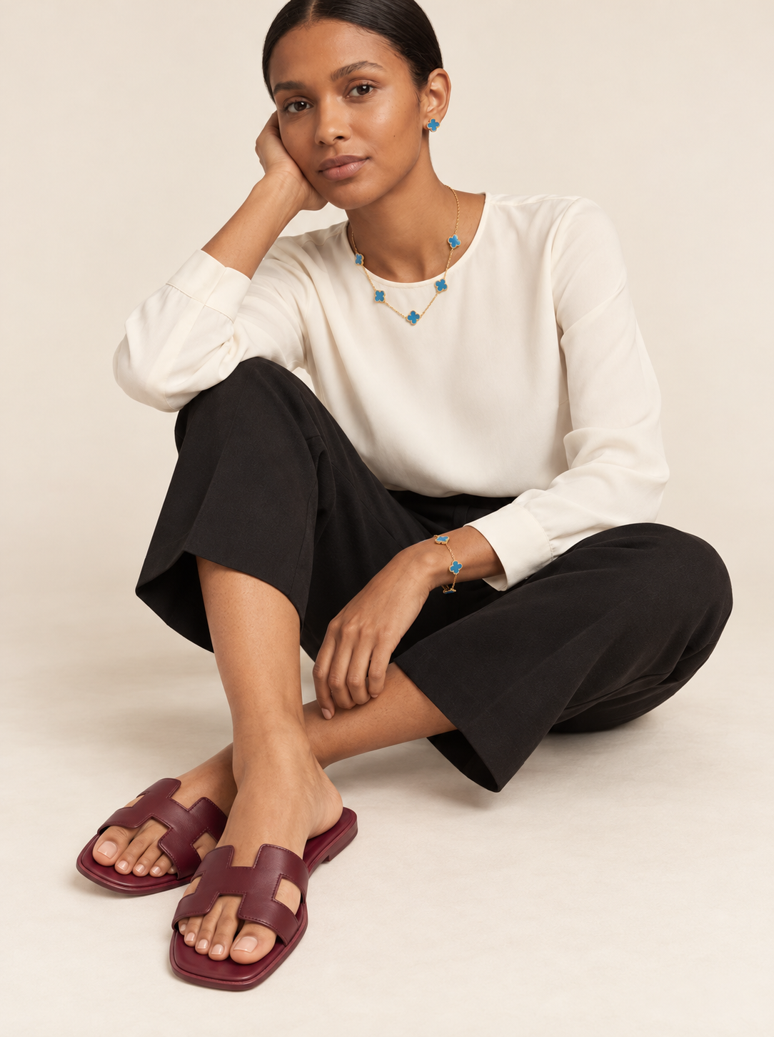 Model wearing burgundy cutout slides