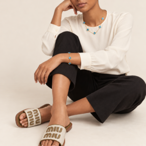 Model wearing white letter detail slides